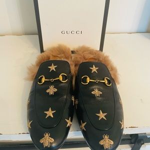 Women’s black GUCCI Princetown mules.